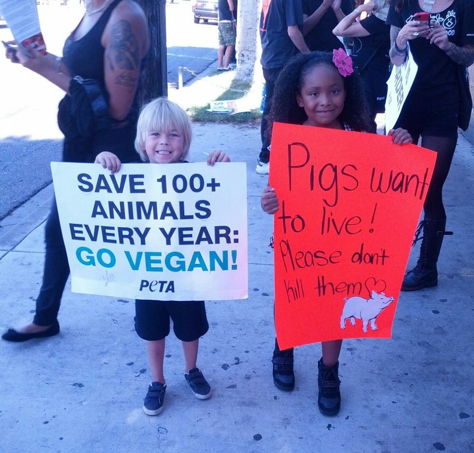 Genesis and friend advocate for veganism.