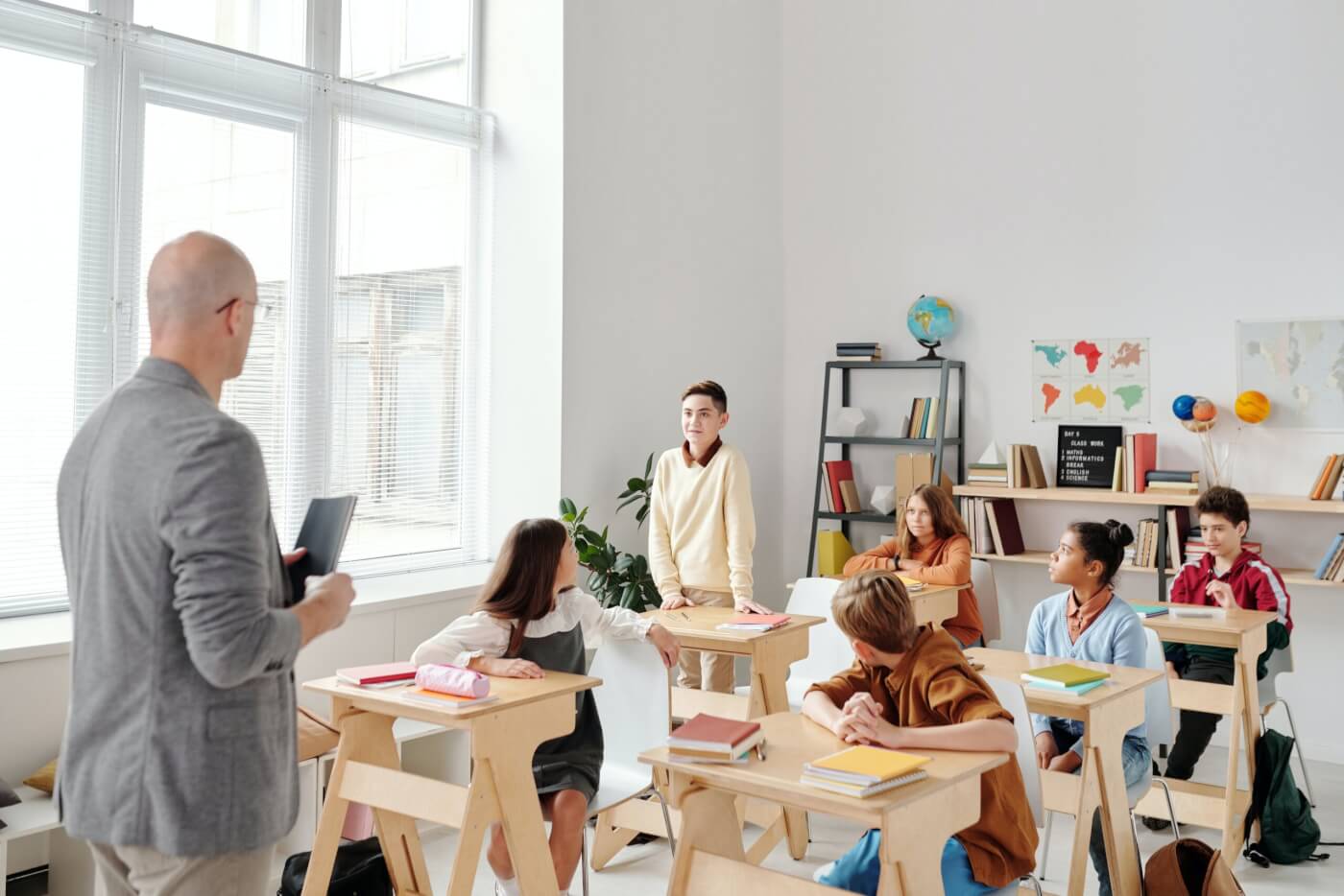 boy standing up in class