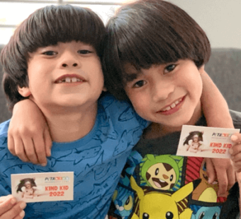 kids with their PETA Kids membership card
