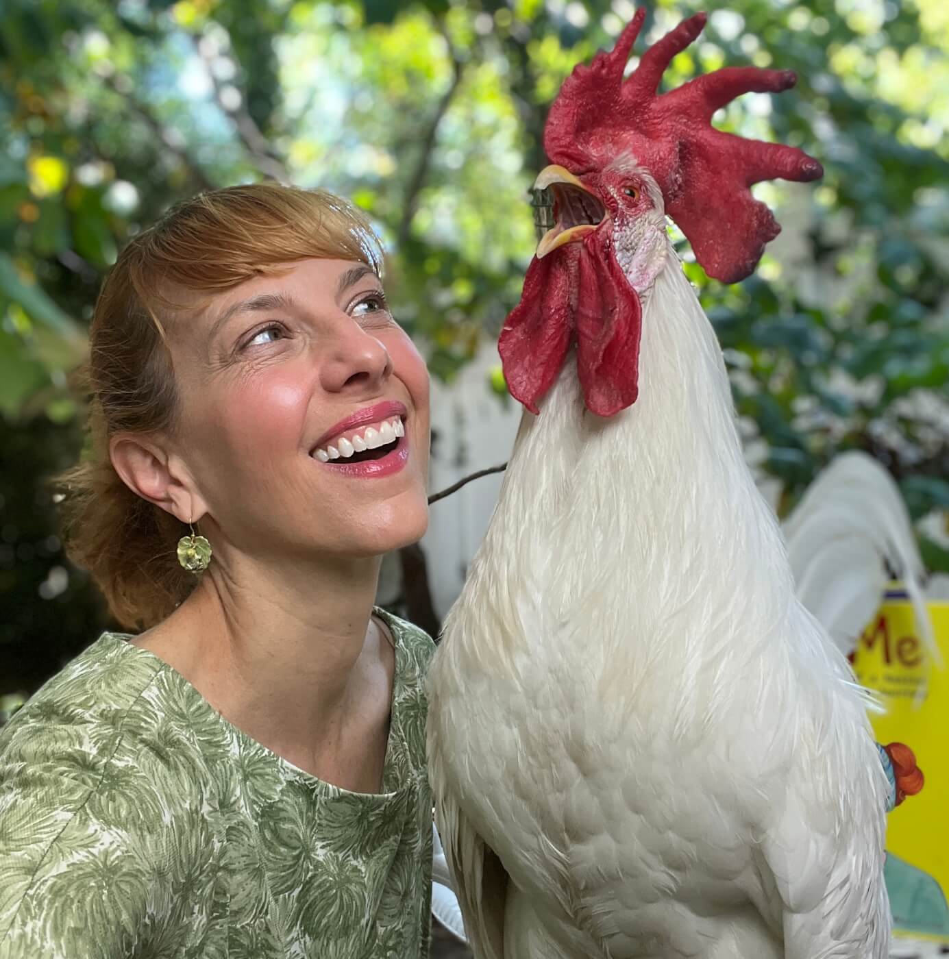 Camille and her rooster Bree cuddled up together outside. 
