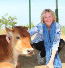 PETA founder Ingrid Newkirk with a cow